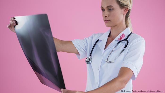 Female doctor looking at X-ray 