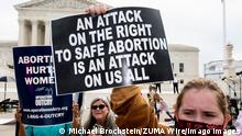  October 4, 2021, Washington, DC, United States: October 4, 2021 - Washington, DC, United States: Protester with a sign saying An attack on the tight to safe abortion is an attack on all of us at a protest with pro-life and pro-choice protesters in front of the Supreme Court. Washington United States - ZUMAb161 20211004_zap_b161_034 Copyright: xMichaelxBrochsteinx
