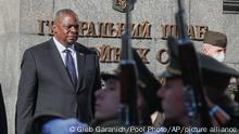 U.S. Defense Secretary Lloyd Austin reviews the honor guard during a welcome ceremony in Kyiv, Ukraine, Tuesday, Oct. 19, 2021. (Gleb Garanich/Pool Photo via AP)