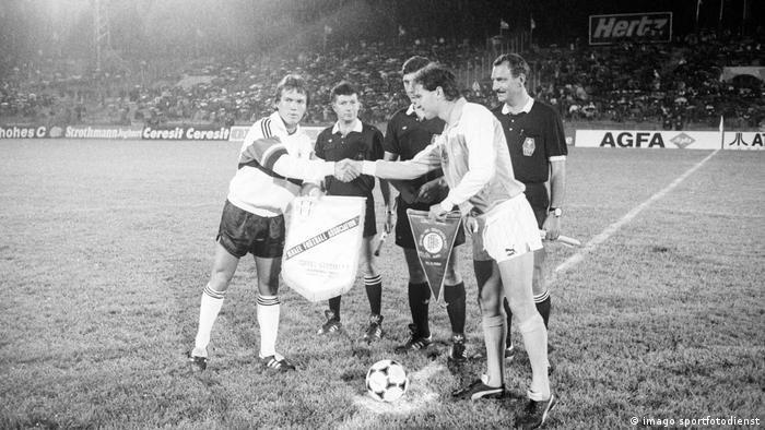Germany captain Lothar Matthäus (left) shaking hands with his Israeli counterpart before a friendly in 1987