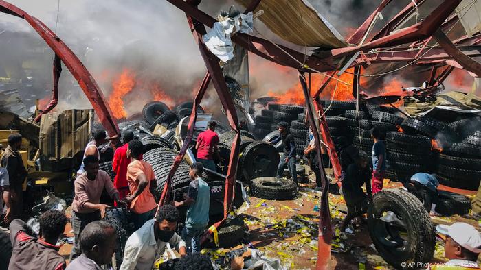 Residents of Tigray's capital Mekele sift through burning wreckage 