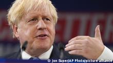 FILE - Britain's Prime Minister Boris Johnson gestures as he makes his keynote speech at the Conservative party conference in Manchester, England, Wednesday, Oct. 6, 2021. Britain agreed to a trade deal with New Zealand on Wednesday, Oct. 20, eliminating tariffs on a wide range of goods as the U.K. seeks to expand economic links around the world following its exit from the European Union. The deal was cemented in a conference call between Johnson and his New Zealand counterpart, Jacinda Ardern, after 16â€¯months of talks by negotiators. (AP Photo/Jon Super, File)