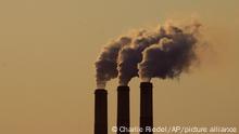 Emissions rise from the smokestacks at the Jeffrey Energy Center coal power plant as the suns sets Saturday, Sept. 18, 2021, near Emmett, Kan. (AP Photo/Charlie Riedel)
