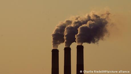 smoke pouring out of 3 smokestacks
