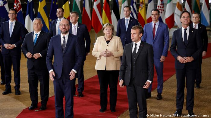 Poland's Prime Minister Mateusz Morawiecki, Hungary's Prime Minister Viktor Orban, Malta's Prime Minister Robert Abela, European Council President Charles Michel, Czech Republic's Prime Minister Andrej Babis, German Chancellor Angela Merkel, Belgium's Prime Minister Alexander De Croo, French President Emmanuel Macron, Spain's Prime Minister Pedro Sanchez, Dutch Prime Minister Mark Rutte and Italy's Prime Minister Mario Draghi pose during a group photo at an EU summit in Brussels