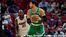 Miami Heat center Dewayne Dedmon (21) defends Boston Celtics center Enes Kanter, right, during the first half of a preseason NBA basketball game, Friday, Oct. 15, 2021, in Miami. (AP Photo/Lynne Sladky)