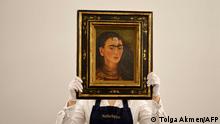 TOPSHOT - An assistant displays the artwork entitled Diego y yo (Diego and I) by Mexican painter Frida Kahlo at Sotheby's auction house in central London on October 21, 2021. (Photo by Tolga Akmen / AFP) / RESTRICTED TO EDITORIAL USE - MANDATORY MENTION OF THE ARTIST UPON PUBLICATION - TO ILLUSTRATE THE EVENT AS SPECIFIED IN THE CAPTION