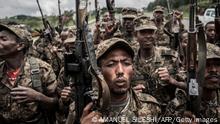 TOPSHOT - Ethiopian National Defence Forces (ENDF) soldiers shout slogans after finishing their training in the field of Dabat, 70 kilometres northeast of the city of Gondar, Ethiopia, on September 14, 2021. (Photo by Amanuel Sileshi / AFP) (Photo by AMANUEL SILESHI/AFP via Getty Images)