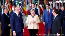 FILE PHOTO: European Council President Charles Michel, German Chancellor Angela Merkel, French President Emmanuel Macron and members of the European Council pose for a family photo during a face-to-face EU summit in Brussels, Belgium, October 21, 2021. REUTERS/Johanna Geron/File Photo