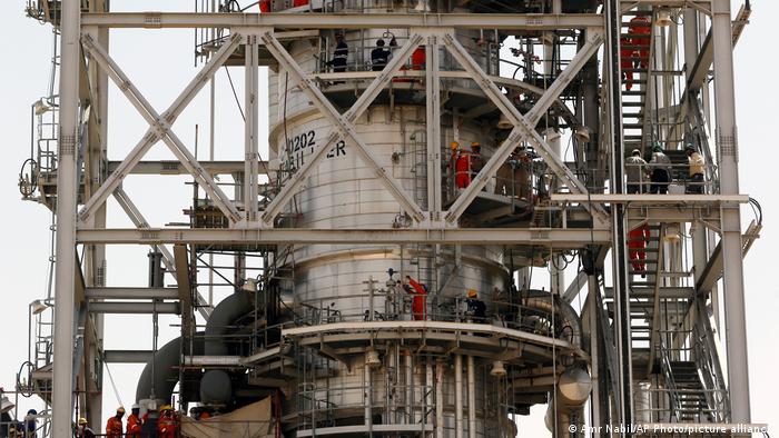 Workers fix the damage in the Aramco's Khurais oil field, Saudi Arabia, Friday, Sept. 20, 2019, after it was hit during Sept. 14 attack.