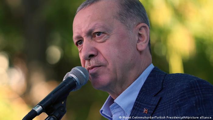 Turkish President Recep Tayyip Erdogan at a microphone