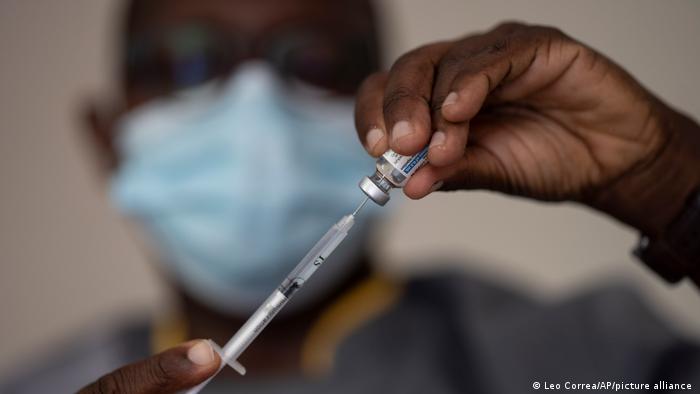 n this Wednesday, July 28, 2021 file photo, a health worker administers a dose of Janssen COVID-19 vaccine by Johnson & Johnson