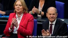 Social democratic candidate for chancellor Olaf Scholz, right, sits next to designated parliament president Baerbel Bas during the first plenary session of the German parliament Bundestag after the elections, Berlin, Tuesday, Oct. 26, 2021. (Photo/Markus Schreiber)
