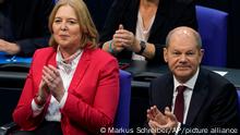 Social democratic candidate for chancellor Olaf Scholz, right, sits next to designated parliament president Baerbel Bas during the first plenary session of the German parliament Bundestag after the elections, Berlin, Tuesday, Oct. 26, 2021. (Photo/Markus Schreiber)