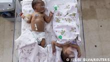 Babies sleep in a shared bed at the maternity unit at the Indira Gandhi hospital in Kabul, Afghanistan October 24, 2021. Picture taken October 24, 2021. REUTERS/Jorge Silva
