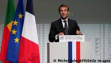 French President Emmanuel Macron delivers a speech at the Quai Branly museum, in Paris, on October 27, 2021 after visiting an exhibition of Benin's treasures displayed at the museum before being shipped to the West African country later this month. - The Paris museum exhibits over a dozen colonial-era treasures taken from Benin, the last time they will be shown in France before being handed back in a landmark gesture. The decision to return them follows growing calls in Africa for European countries to return the colonial spoils from museums. The move is part of a drive by French President Emmanuel Macron to improve his country's image in Africa, especially among young people. (Photo by Michel Euler / POOL / AFP) (Photo by MICHEL EULER/POOL/AFP via Getty Images)