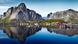 A fjord in Norway with a village and mountain reflected in the water A fjord in Norway with a village and mountain reflected in the water