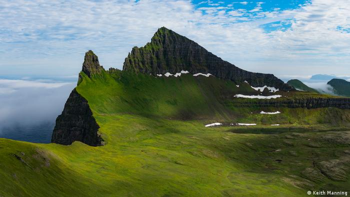 Grass covered mountain cliffs in Iceland