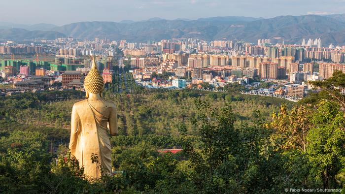 View from a hillside with a Buddha statue of the cityscape of Jinghong, Xishuangbanna, China