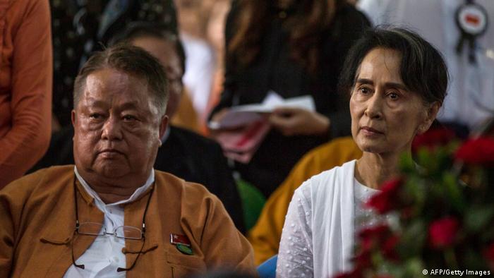 Aung San Suu Kyi and U Win Htein at a funeral service.