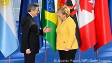 30.10.2021
Italy's Prime Minister, Mario Draghi (L) greets German outgoing Chancellor Angela Merkel as he arrives for the G20 of World Leaders Summit on October 30, 2021 at the convention center La Nuvola in the EUR district of Rome. (Photo by Alberto PIZZOLI / AFP) (Photo by ALBERTO PIZZOLI/AFP via Getty Images)
