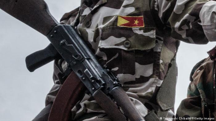 Closeup of a Tigray fighter and his weapon