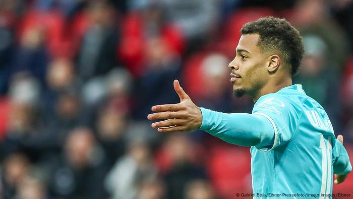 Wolfsburg's Lukas Nmecha celebrates his goal against Bayer Leverkusen