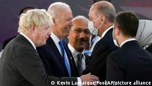U.S. President Joe Biden, second from left, and British Prime Minister Boris Johnson, left, share a word with Turkey's President Tayyip Erdogan, second from right, at the La Nuvola conference center for the G20 summit in Rome, Saturday, Oct. 30, 2021. The two-day Group of 20 summit is the first in-person gathering of leaders of the world's biggest economies since the COVID-19 pandemic started. (Kevin Lamarque/Pool Photo via AP)