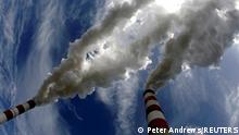 FILE PHOTO: Smoke billows from the chimneys of Belchatow Power Station, Europe's biggest coal-fired power plant, in this May 7, 2009, photo. REUTERS/Peter Andrews/File Photo