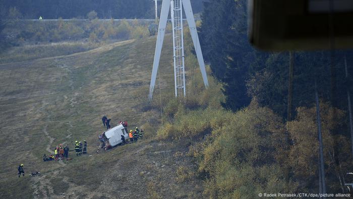 Rescuers work on a scene of a fallen funicular cab under the Jested Mountain in Liberec, Czech Republic