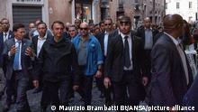 Brazil's President, Jair Bolsonaro, surrounded by his bodyguards, walks in the center of Rome, Italy, 29 October 2021. Bolsonaro arrived in Rome to attend G20 summit of world leaders to discuss climate change, Covid-19 and the post-pandemic global recovery. ANSA/ MAURIZIO BRAMBATTI