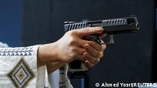 Saudi female firearm trainer Mona Al Khurais takes aim with her pistol at the Top-Gun shooting range in Riyadh, Saudi Arabia, October 28, 2021. Picture taken October 28, 2021. REUTERS/Ahmed Yosri