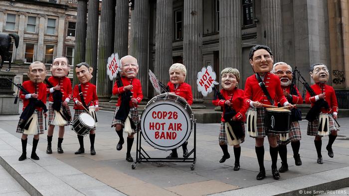 Oxfam activists in the Hot Air Band dressed in costumes like world leaders