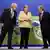 O anfitrião da COP26, o premiê britânico Boris Johnson, a chanceler alemã Angela Merkel e o chefe da ONU, António Guterres
