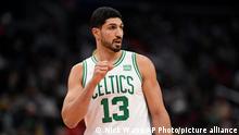 Boston Celtics center Enes Kanter (13) looks on during the first half of an NBA basketball game against the Washington Wizards, Saturday, Oct. 30, 2021, in Washington. (AP Photo/Nick Wass)