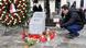 A man lights a candle next to a memorial for the victims of last year's attack in Vienna A man lights a candle next to a memorial for the victims of last year's attack in Vienna