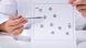 A doctor holds up a neurological test A doctor holds up a neurological test
