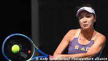 China's Peng Shuai makes a backhand return to Japan's Nao Hibino during their first round singles match at the Australian Open tennis championship in Melbourne, Australia, Tuesday, Jan. 21, 2020. (AP Photo/Andy Brownbill)