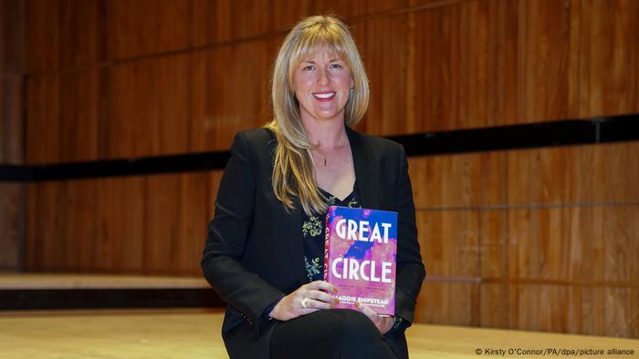 Maggie Shipstead holds up her book, Great Circle