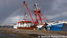 02.11.21 *** A rainbow appears as British trawler Cornelis Gert Jan is seen moored in the port of Le Havre, after being seized last week fishing in the French territorial waters without licence, in Le Havre, France, November 2, 2021. REUTERS/Stephane Mahe