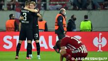 Frankfurt's Norwegian forward Jens Petter Hauge (R) celebrates with a teammate after scoring during the UEFA Europa League group D football match between Olympiacos FC and Eintracht Frankfurt at the Karaiskakis Stadium, in Piraeus, near Athens on November 4, 2021. (Photo by Aris MESSINIS / AFP)