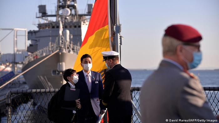Tilo Kalski, captain of the German Navy frigate Bayern, and Japan's Defense Minister Nobuo Kishi