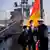 Tilo Kalski, captain of the German Navy frigate Bayern, and Japan's Defense Minister Nobuo Kishi
