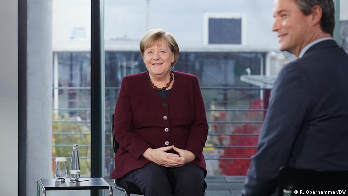 Chancellor Merkel and DW Head of News Max Hofmann