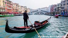 A gondola is pictured on Grand Canal in front of Rialto bridge in Venice, Italy, October 20, 2021. REUTERS/Fabrizio Bensch - REFILE - CORRECTING YEAR