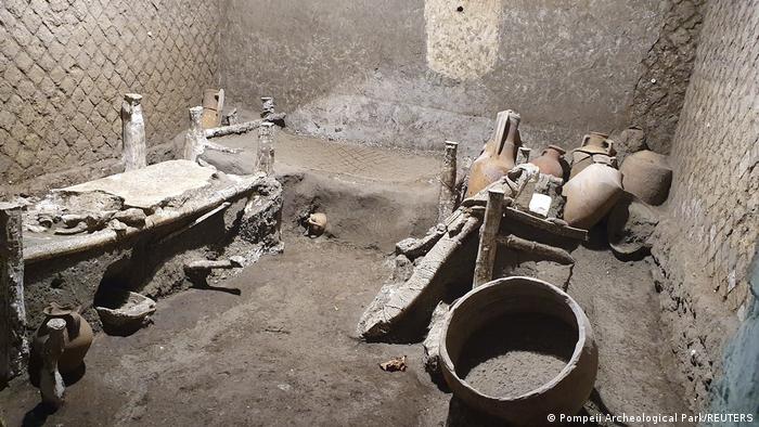 The 'slaves room' at a Roman villa containing beds, amphorae, ceramic pitchers and a chamber pot
