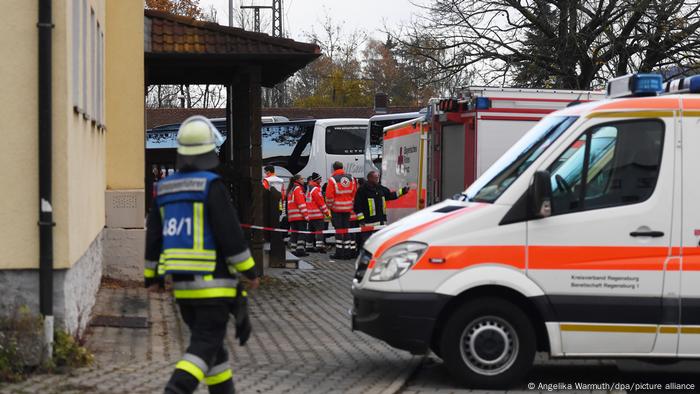 Emergency services treating passengers from the train