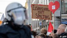 People take part in a demonstration of Germany's Querdenker (Lateral Thinkers) movement that emerged as the loudest voice against the government's coronavirus curbs, on November 6, 2021 in Leipzig, eastern Germany. - The movement is attracting a wide mix of people including vaccine sceptics, neo-Nazis and members of the far-right AfD party. (Photo by STRINGER / AFP)