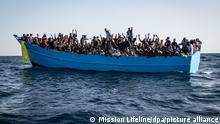 African migrants crowded in a small boat.