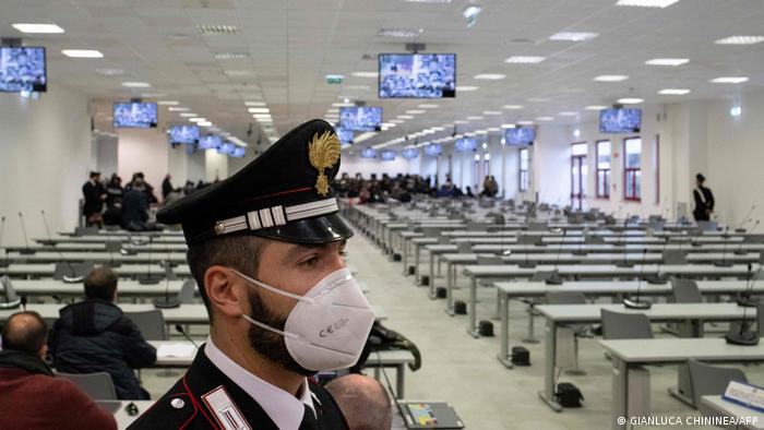 A Carabinieri police officer wearing a face mask stands guard as a general view shows a special courtroom on January 13, 2021 on the opening day of the 'Rinascita-Scott' maxi-trial in which more than 350 alleged members of Calabria's 'Ndrangheta mafia group and their associates go on trial in Lamezia Terme, Calabria